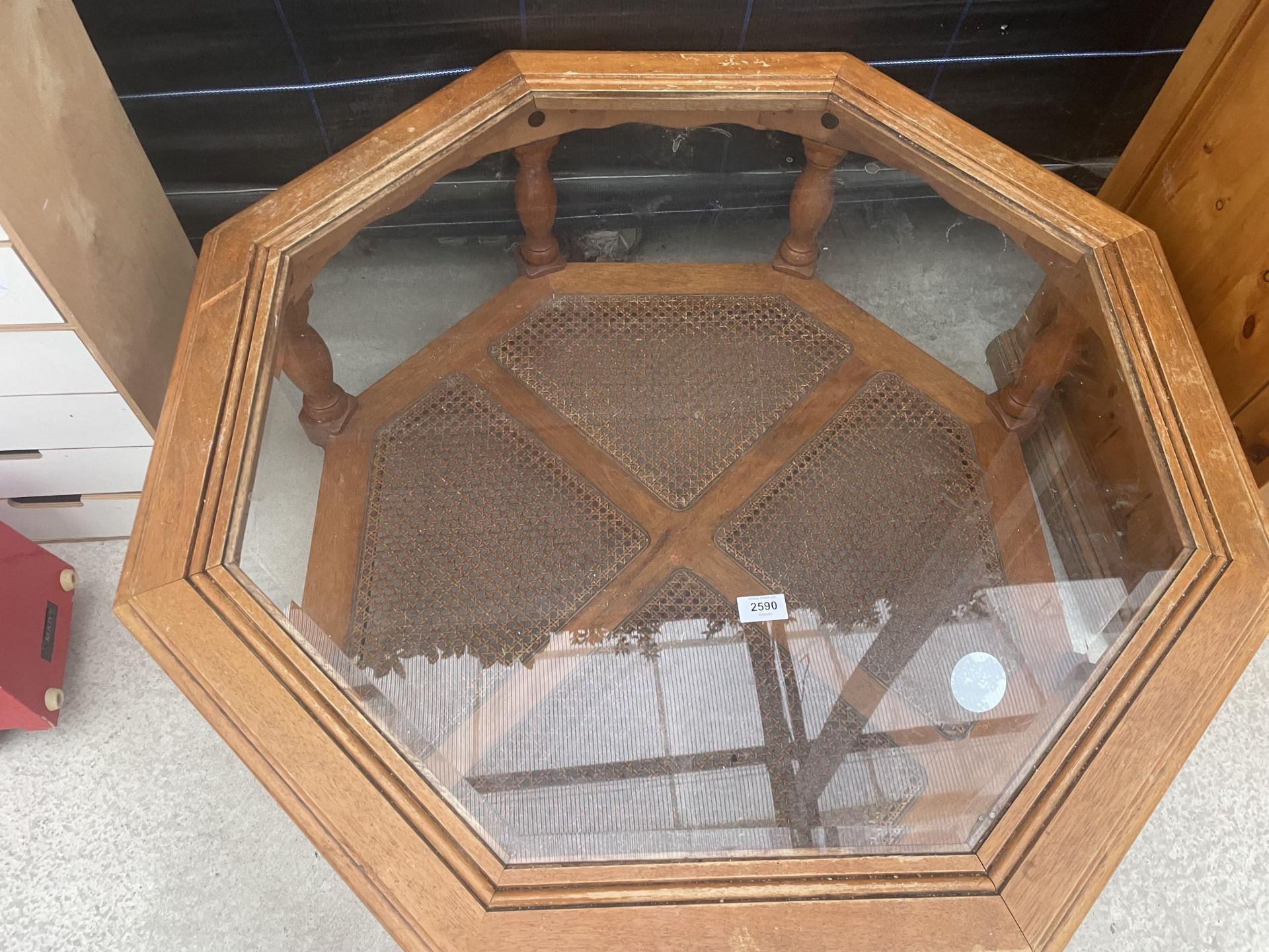 A MODERN OCTAGANOL TWO TIER COFFEE TABLE WITH INSET GLASS TOP AND CANE UNDER TIER 40" ACROSS - Image 2 of 3