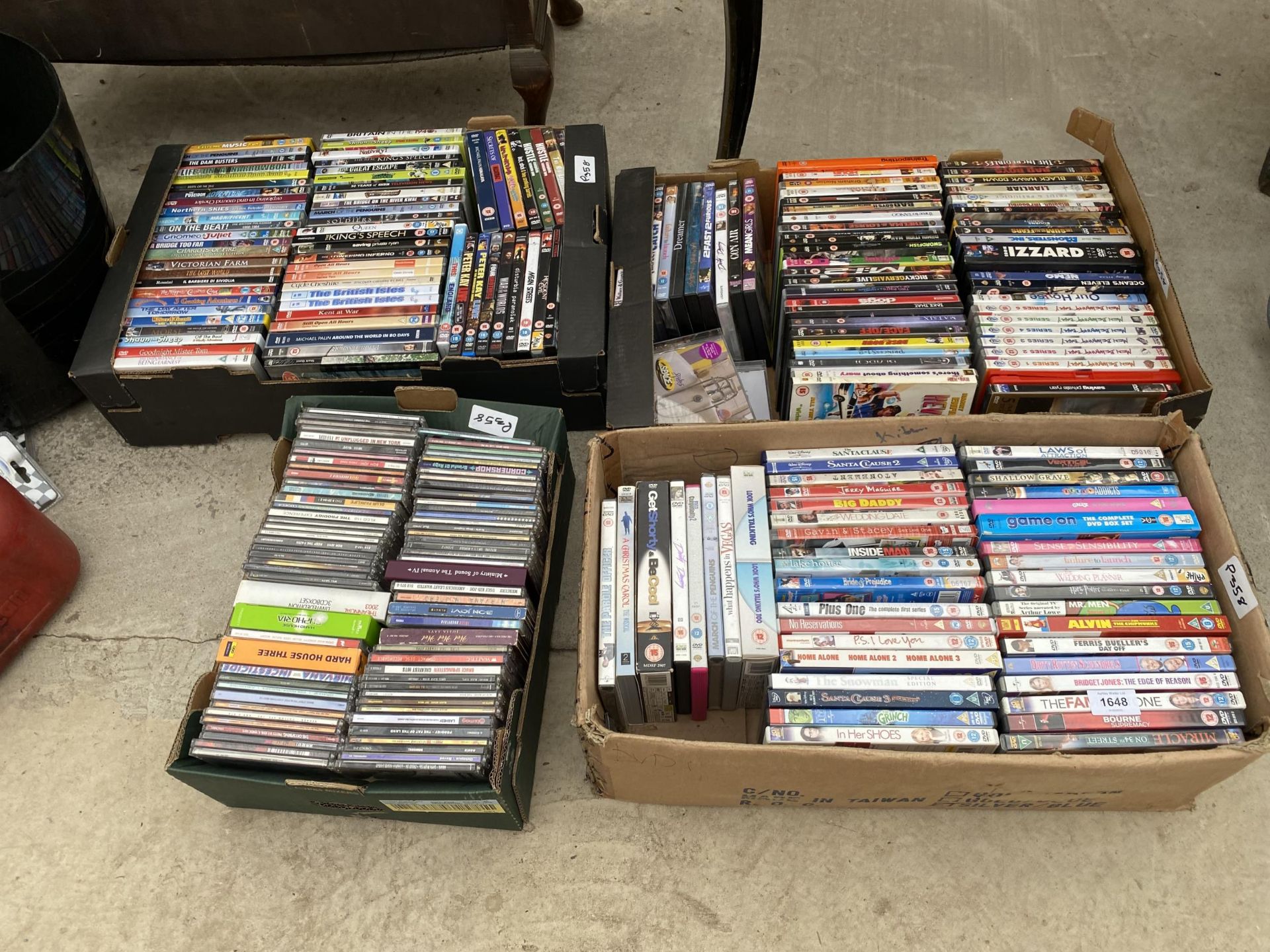 A LARGE ASSORTMENT OF DVDS AND CDS