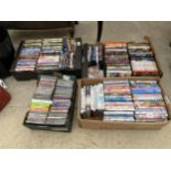 A LARGE ASSORTMENT OF DVDS AND CDS