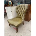 A VICTORIAN STYLE SPOON BUTTON-BACK NURSING CHAIR ON TURNED FRONT LEGS