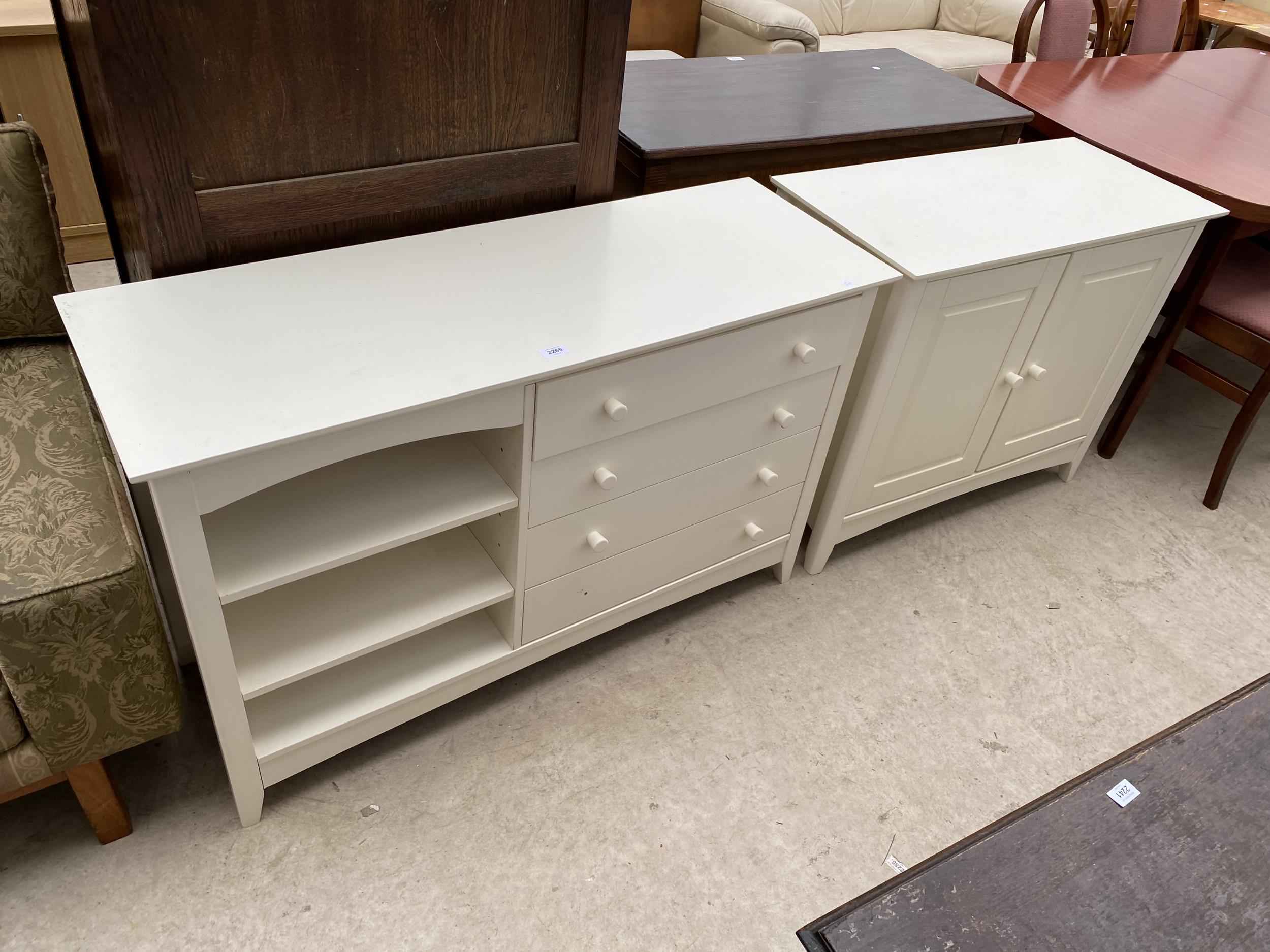 A MODERN WHITE TWO DOOR CABINET AND MATCHING CHEST OF FOUR DRAWERS WITH OPEN SIDE SECTION