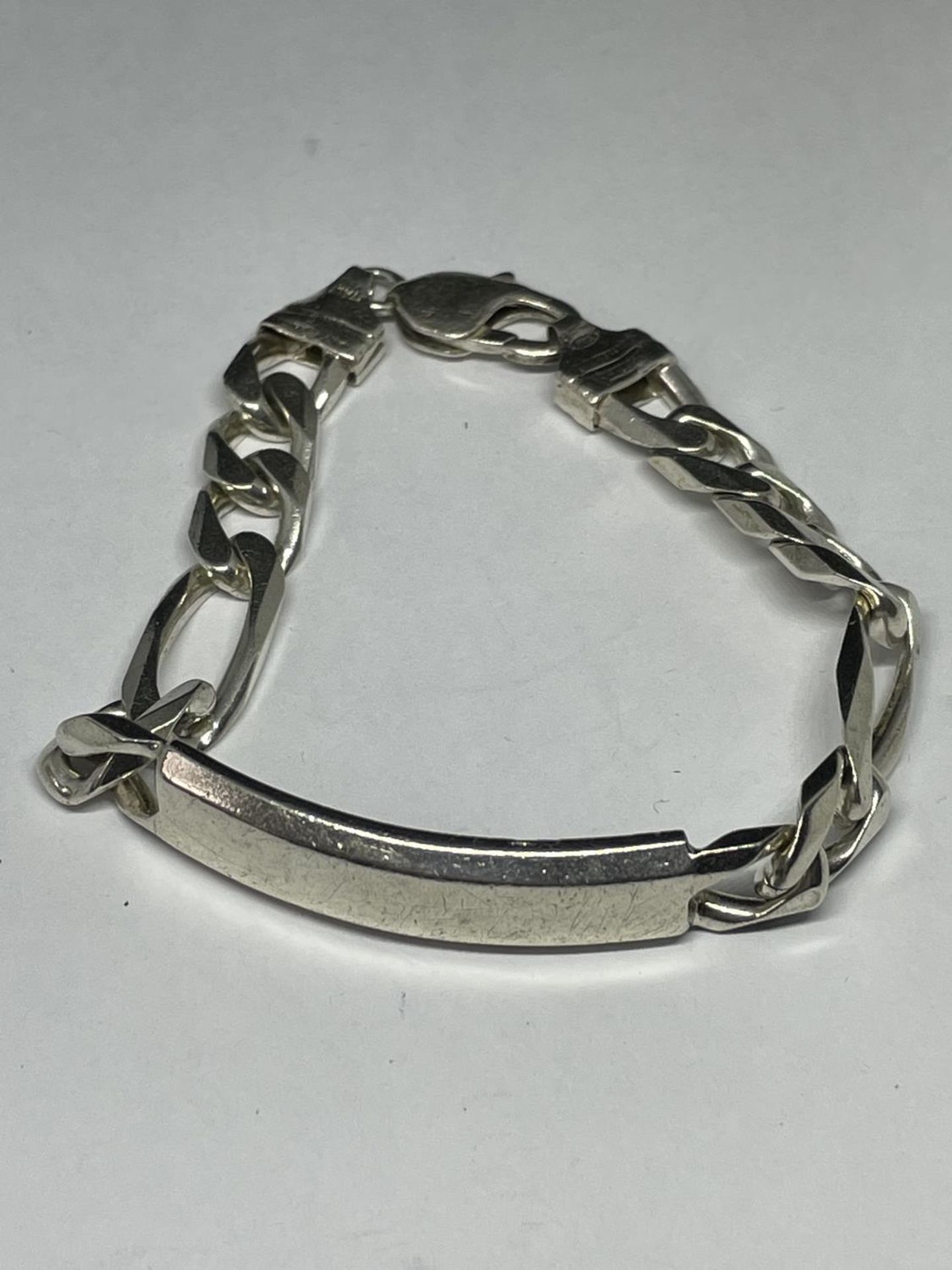 A MARKED SILVER HEAVY IDENTITY BRACELET