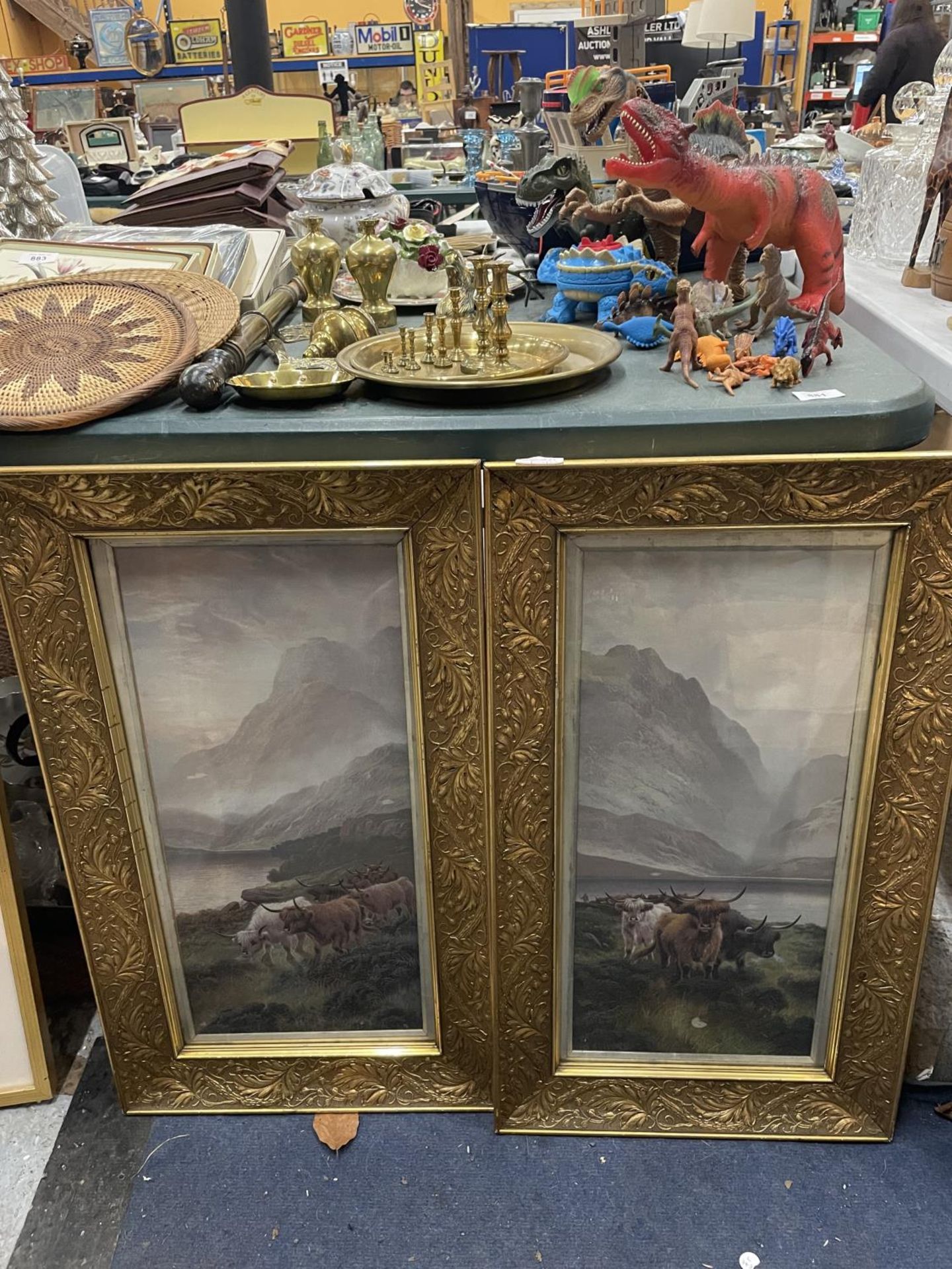 A PAIR OF ORNATELY GILT FRAMED PRINTS OF HIGHLAND CATTLE