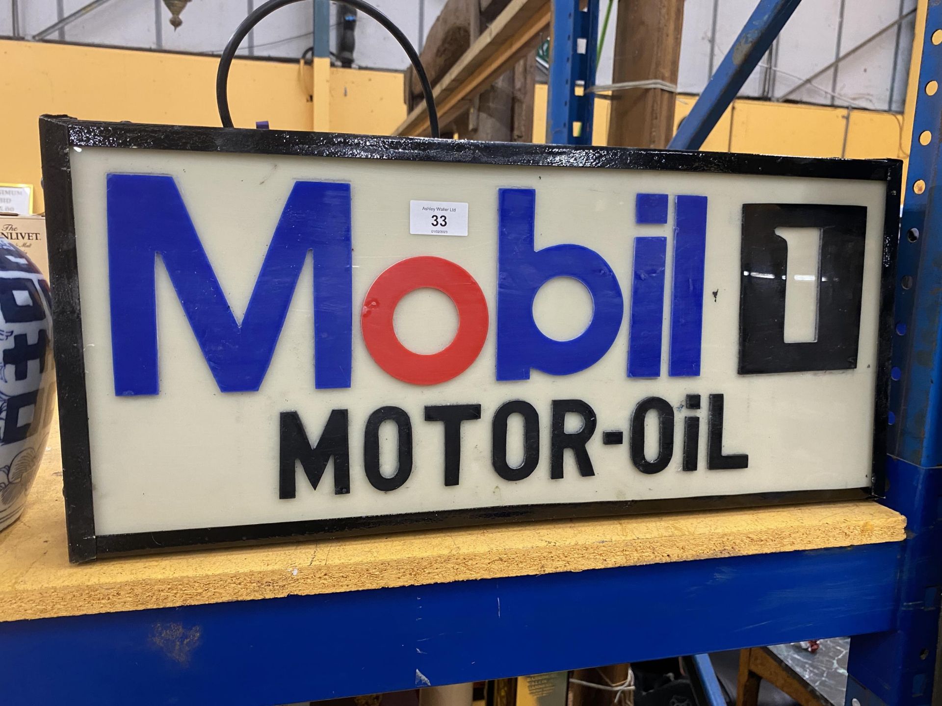 A MOBIL 1 MOTOR OIL ILLUMINATED BOX SIGN, 58 X 26 X 10CM