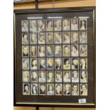 A MAHOGANY FRAMED PICTURE CONTAINING CIGARETTE CARDS