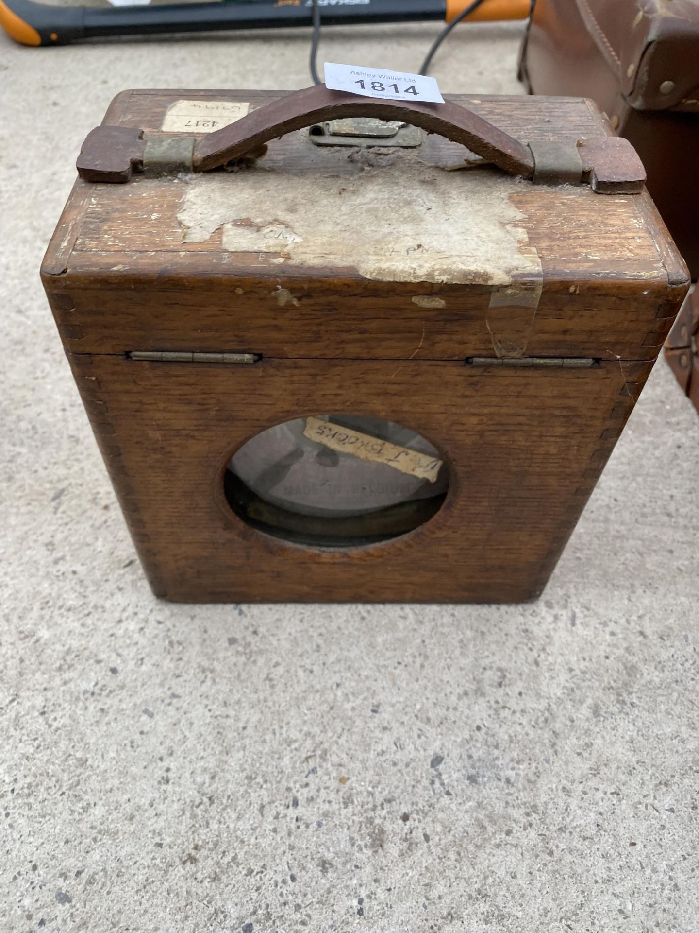 A VINTAGE WOODEN CASED PIGEON TIMING CLOCK