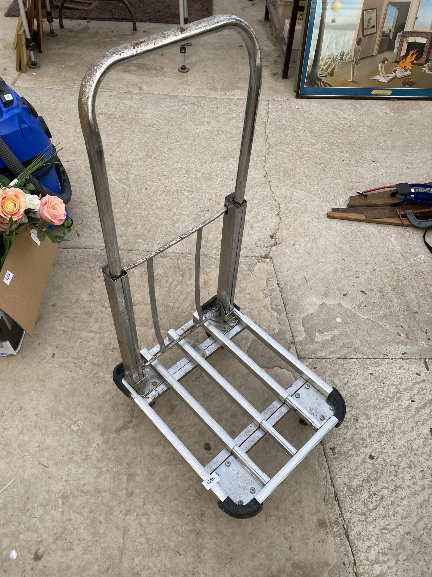 A METAL FOUR WHEELED TROLLEY