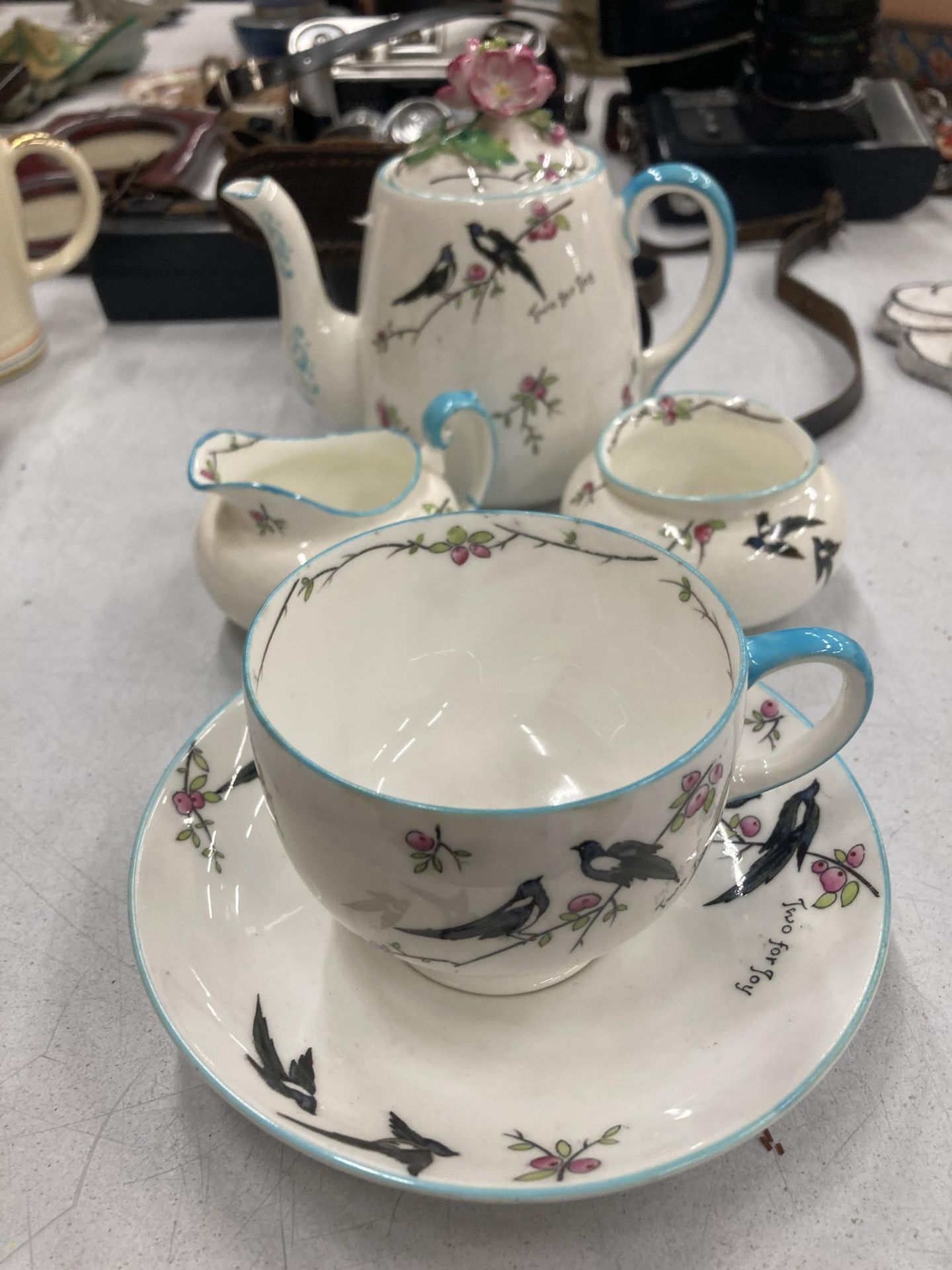 A PARAGON TEASET FOR ONE TO INCLUDE A TEAPOT, CREAM JUG, SUGAR BOWL CUP, SAUCER AND SIDE PLATE