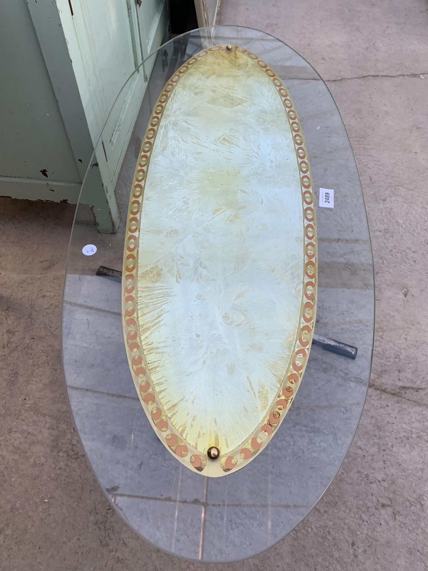 A RETRO 1970'S OVAL GLASS COFFEE TABLE, 38X17", ON ALLOY BASE - Image 2 of 3