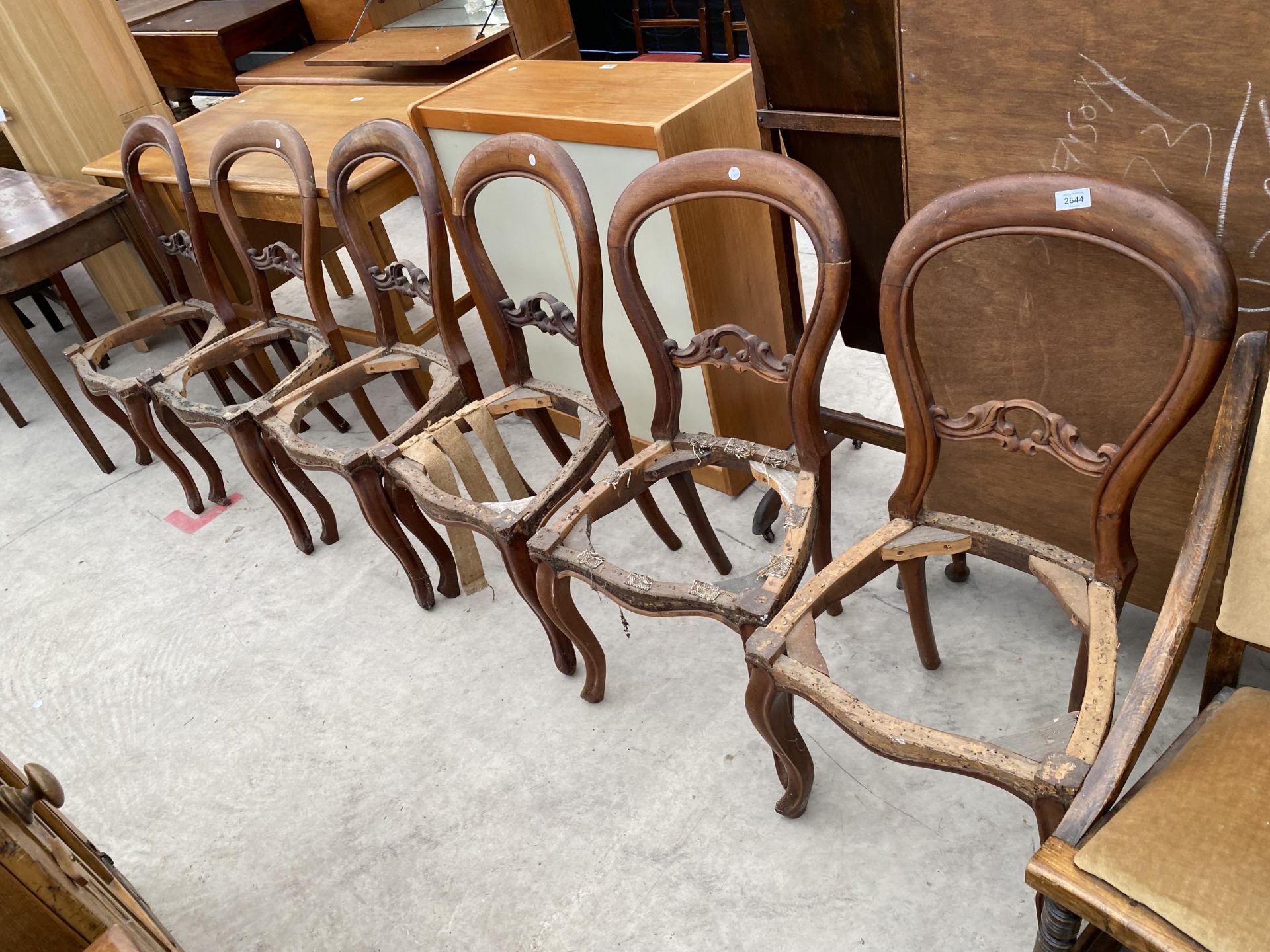 A SET OF SIX VICTORIAN MAHOGANY DINING CHAIRS, LACKING SEATS