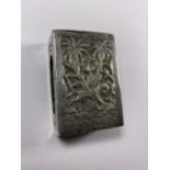 AN UNUSUAL ORIENTAL SILVER MATCHBOX HOLDER