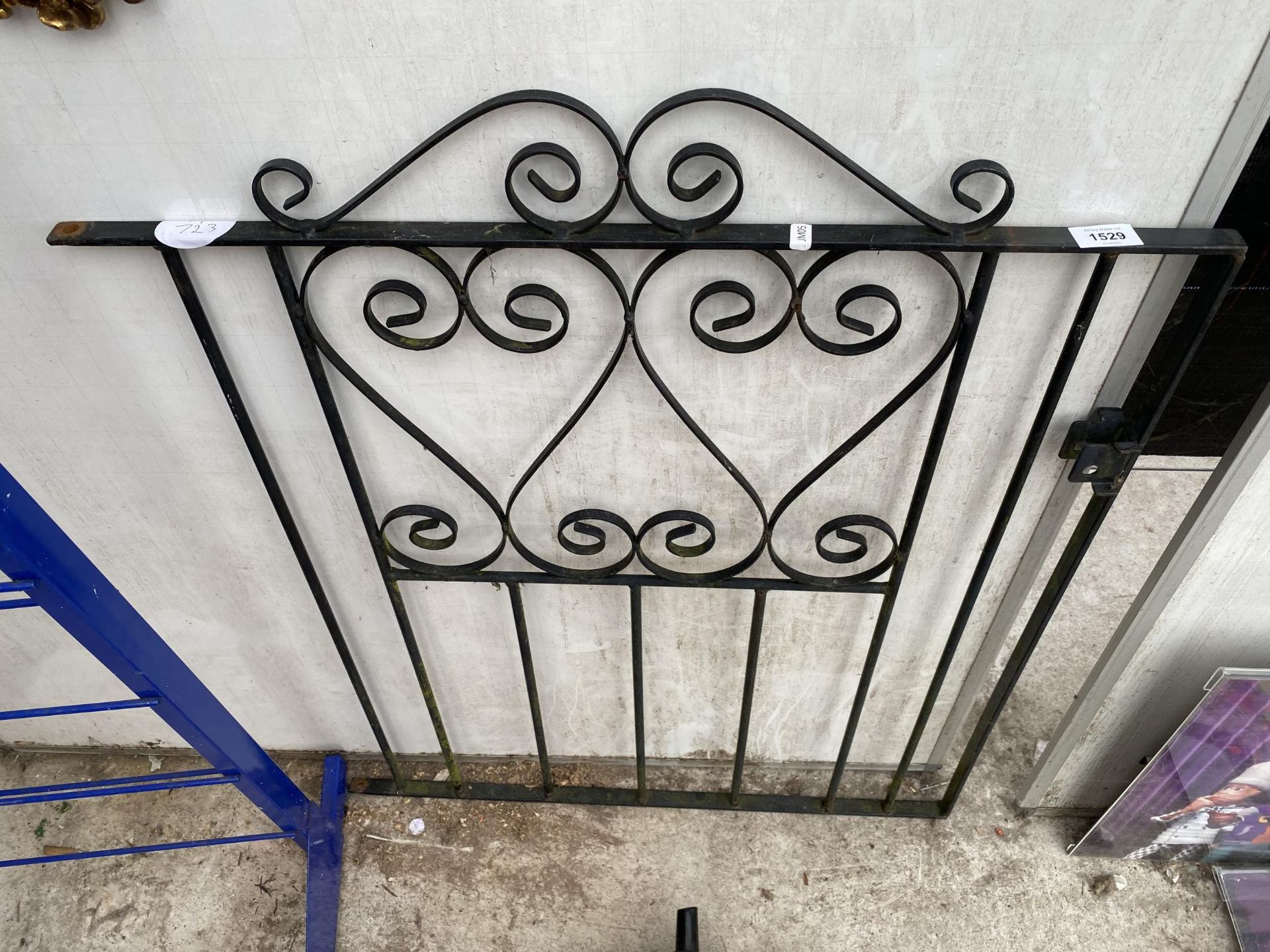 A SMALL WROUGHT IRON PEDESTRIAN GARDEN GATE