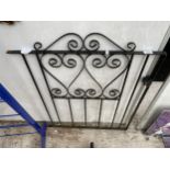 A SMALL WROUGHT IRON PEDESTRIAN GARDEN GATE