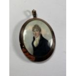 A 19TH CENTURY OVAL PORTRAIT MINIATURE OF A GENTLEMAN IN BELIEVED GOLD FRAME