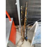 AN ASSORTMENT OF VINTAGE SPLIT CANE FISHING RODS AND MODERN CARBON FIBRE RODS