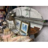 A VINTAGE FRAMELESS OVAL MIRROR WITH GEOMETRIC EDGES