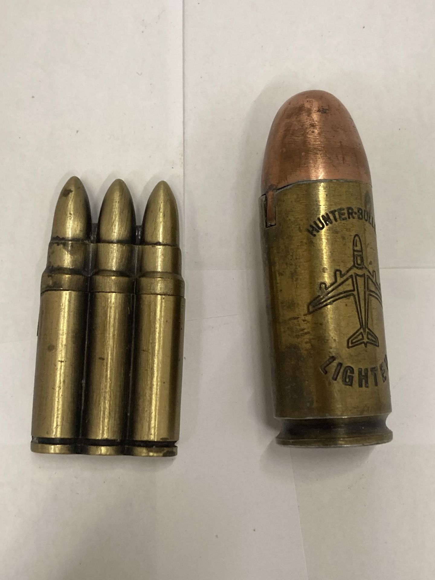 TWO NOVELTY LIGHTERS IN THE FORM OF BULLETS