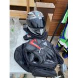 AN AGV MOTORBIKE HELMET AND TWO MOTOR BIKE BACK PACKS