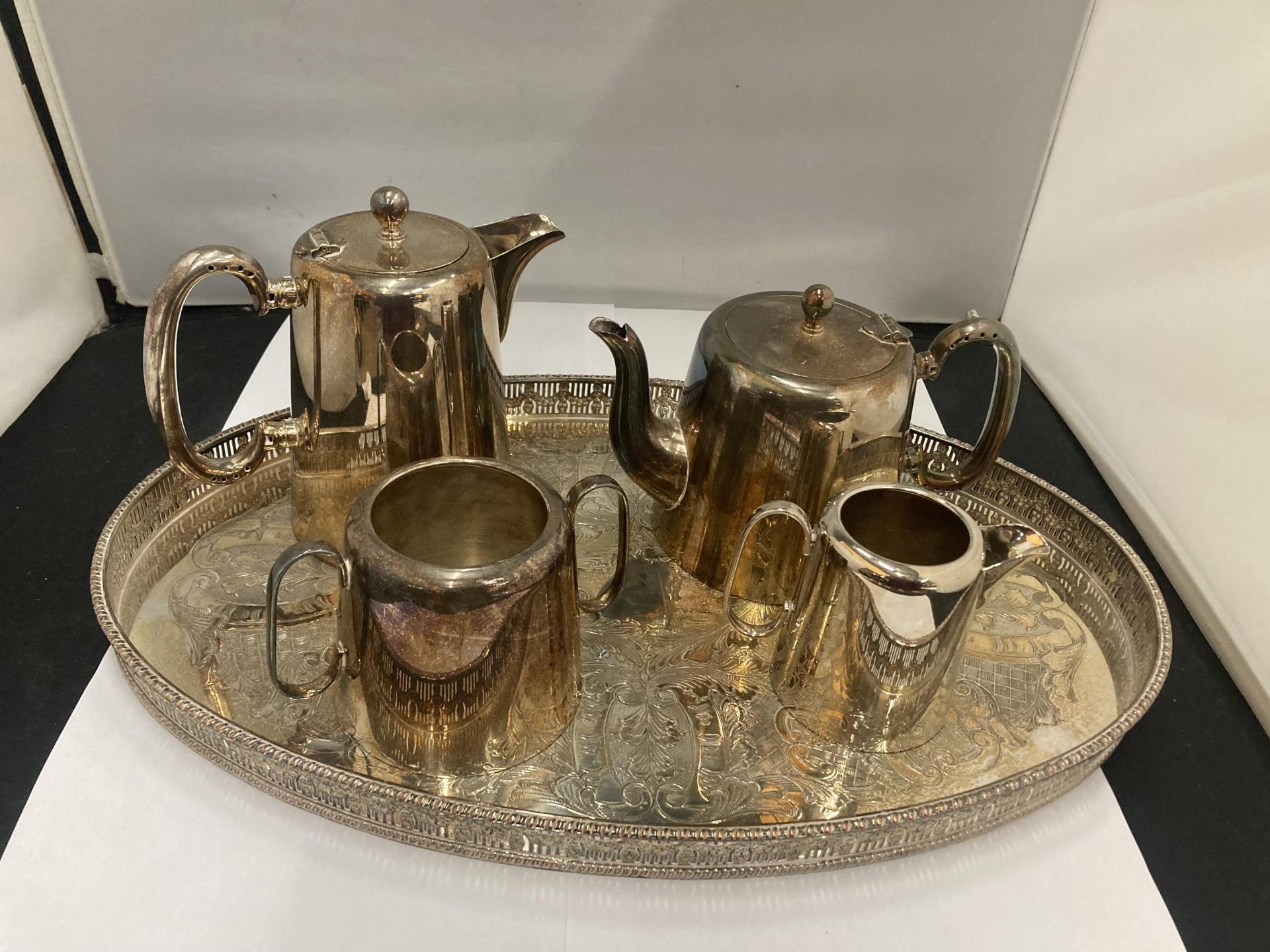 A SILVER PLATED GALLERY TRAY PLUS 'HASTINGS PLATE' COFFEE AND TEAPOT, CREAM JUG AND SUGAR BOWL