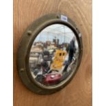 A BRASS FRAMED PORTHOLE MIRROR