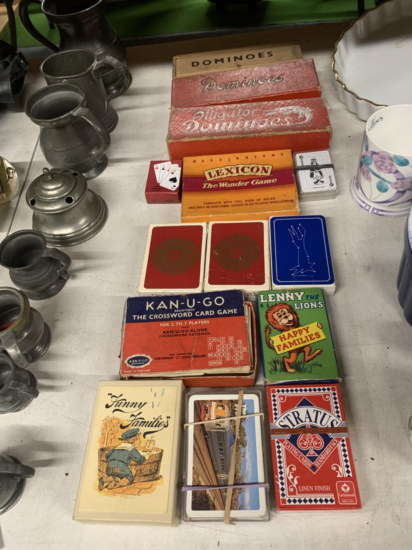 A QUANTITY OF VINTAGE PLAYING CARDS AND DOMINOES