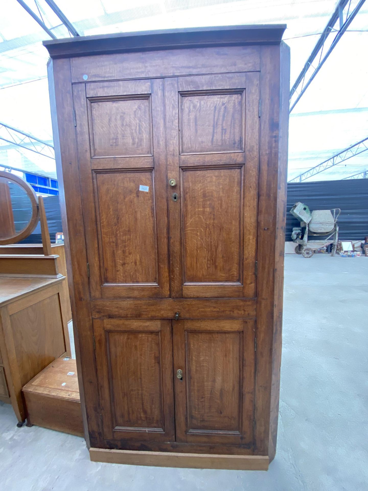 A GEORGE III OAK FULL LENGTH PANELLED FOUR DOOR CORNER CUPBOARD, 41" WIDE, 77" HIGH AND 22" DEEP