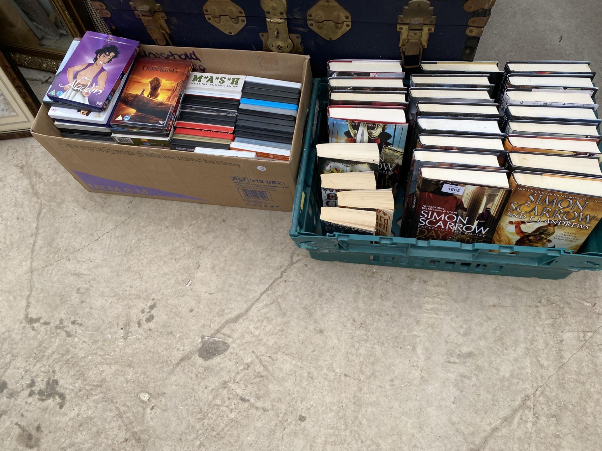 AN ASSORTMENT OF DVDS AND BOOKS