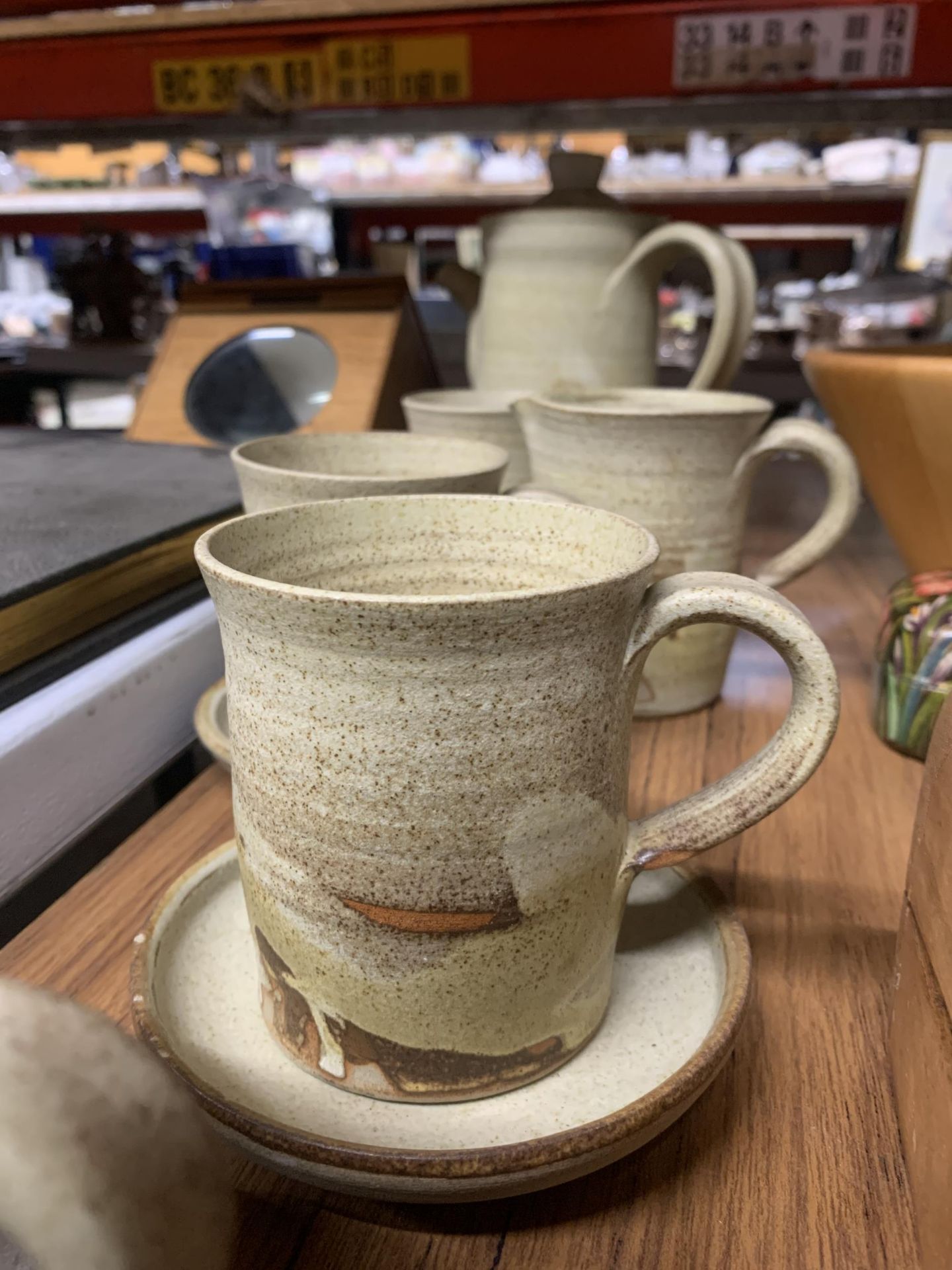A STUDIO POTTERY COFFEE SET TO INCLUDE A COFFEE POT, CREAM JUG, MUGS AND SAUCERS - Image 2 of 4