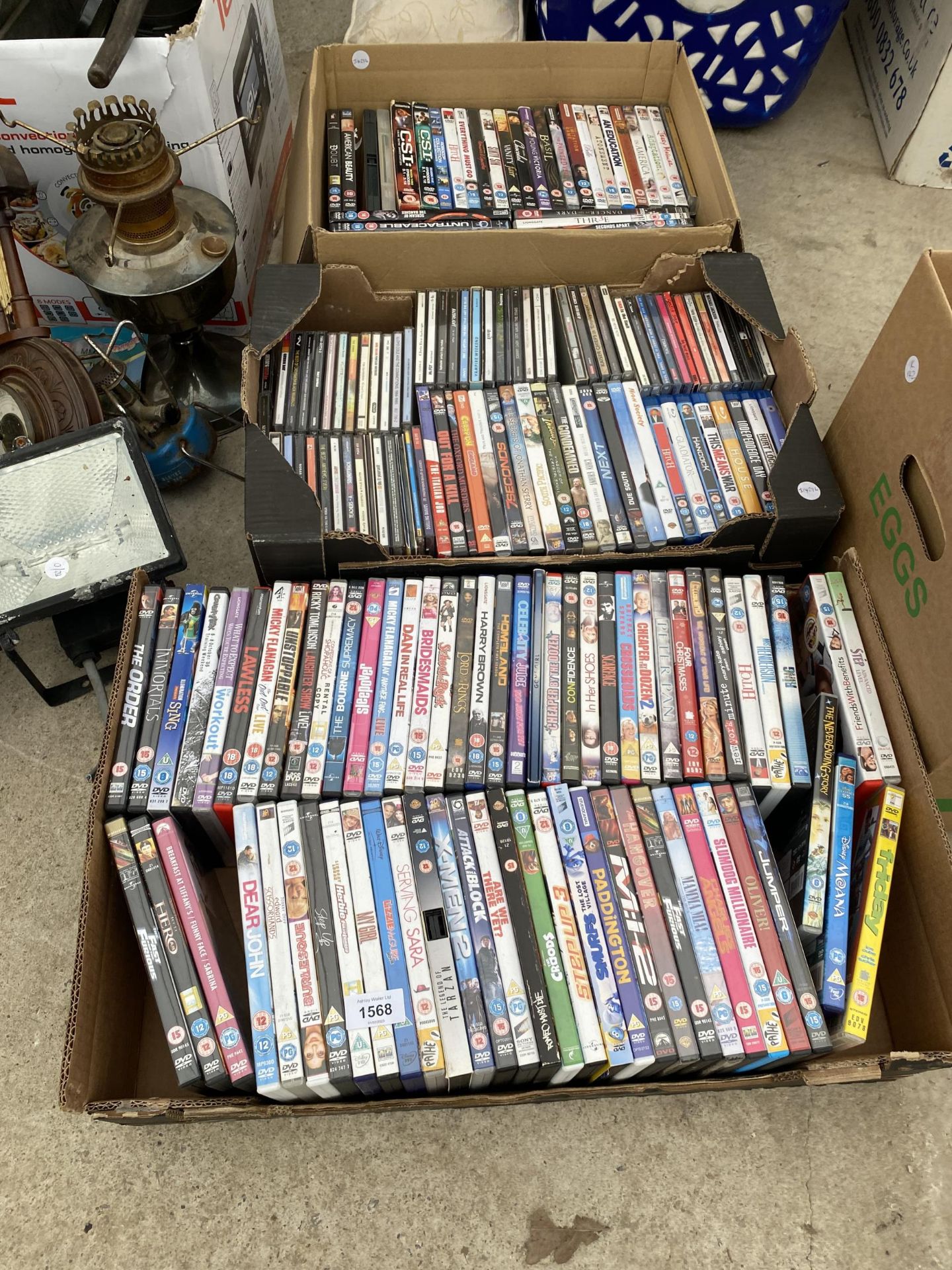 A LARGE ASSORTMENT OF DVDS AND CDS