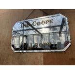 AN ART DECO UNFRAMED EIGHT SIDED BEVELED EDGE MIRROR BEARING THE NAME 'IND COOPE ALLSOPP' COMPLETE