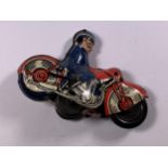 A VINTAGE TINPLATE MOTORCYCLE