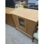 A MODERN OAK CABINET