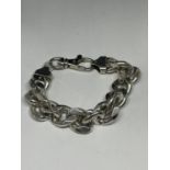 A HEAVY SILVER WRIST CHAIN WITH METAL CLASP