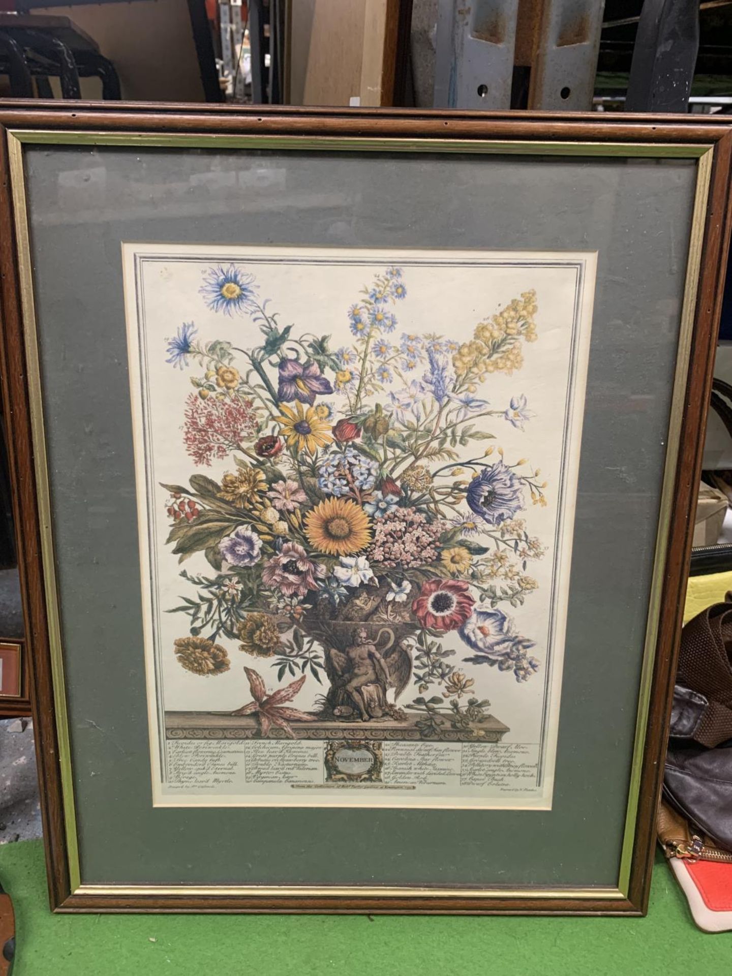 A FRAMED PRINT DEPICTING FLOWERS