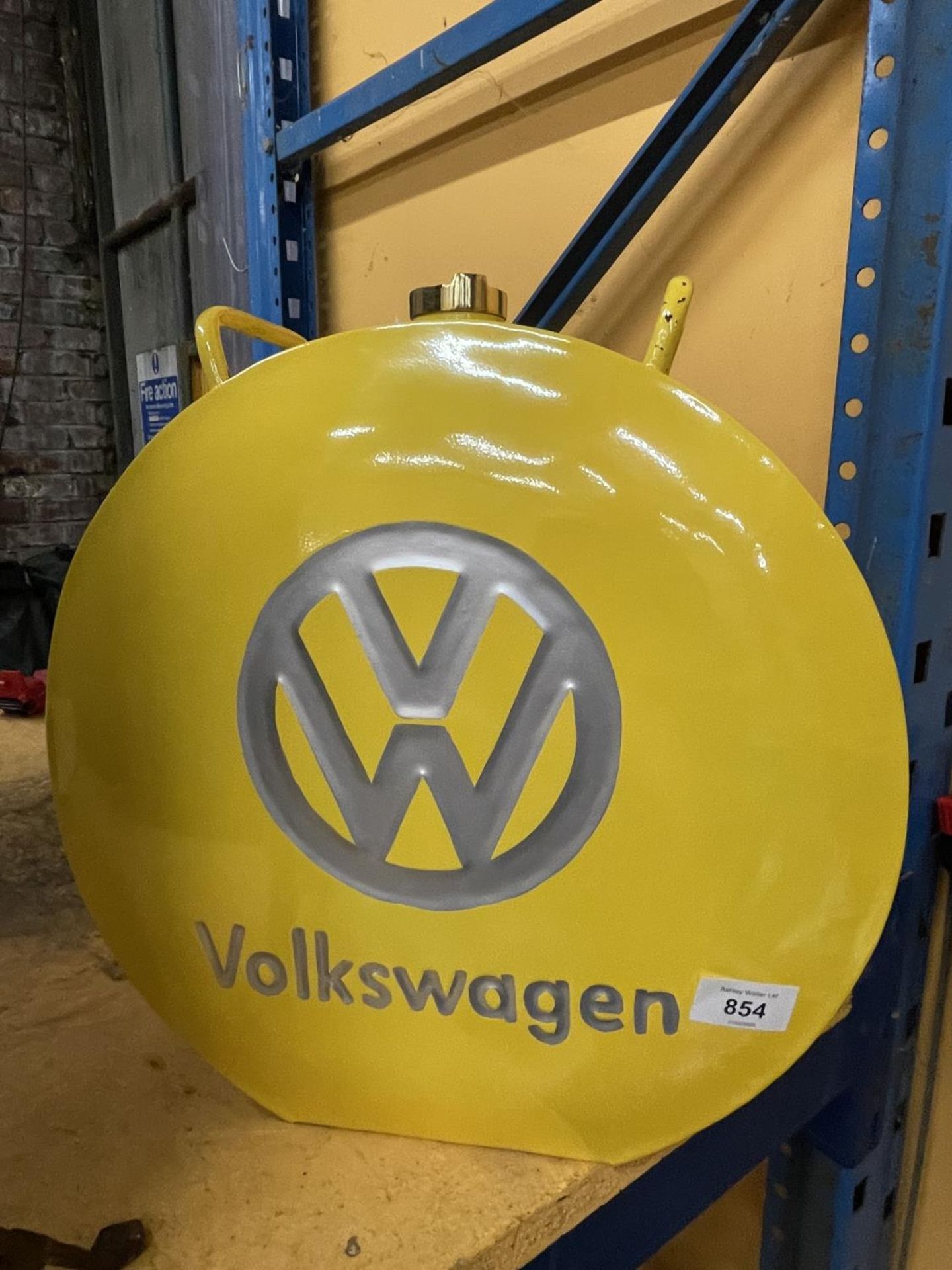 A YELLOW VOLKSWAGON PETROL CAN