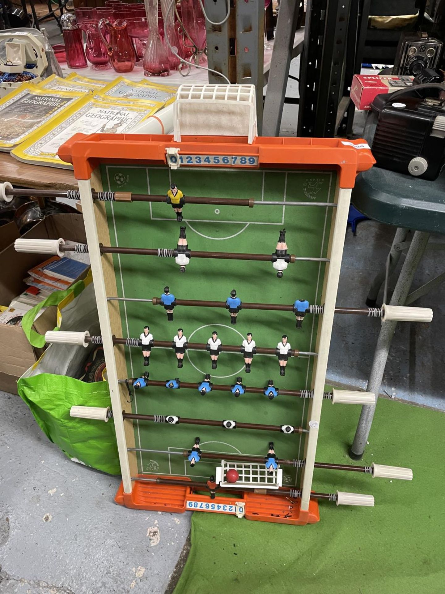 A VINTAGE TABLE SOCCER GAME - ONE PLAYER HAS LOST HIS HEAD, WIDTH 45CM, LENGTH APPROX 89CM