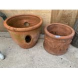 A VINTAGE TERRACOTTA PLANTER AND A FURTHER TERRACOTTA STRAWBERRY PLANTER