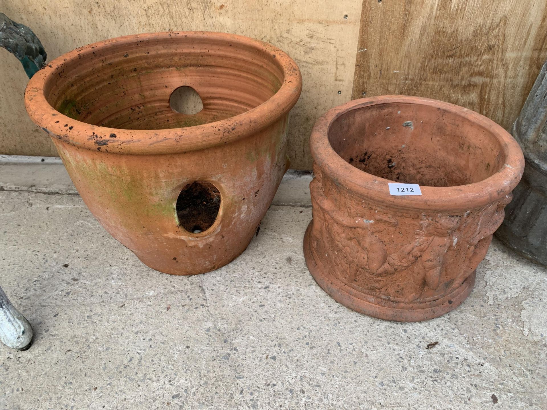 A VINTAGE TERRACOTTA PLANTER AND A FURTHER TERRACOTTA STRAWBERRY PLANTER