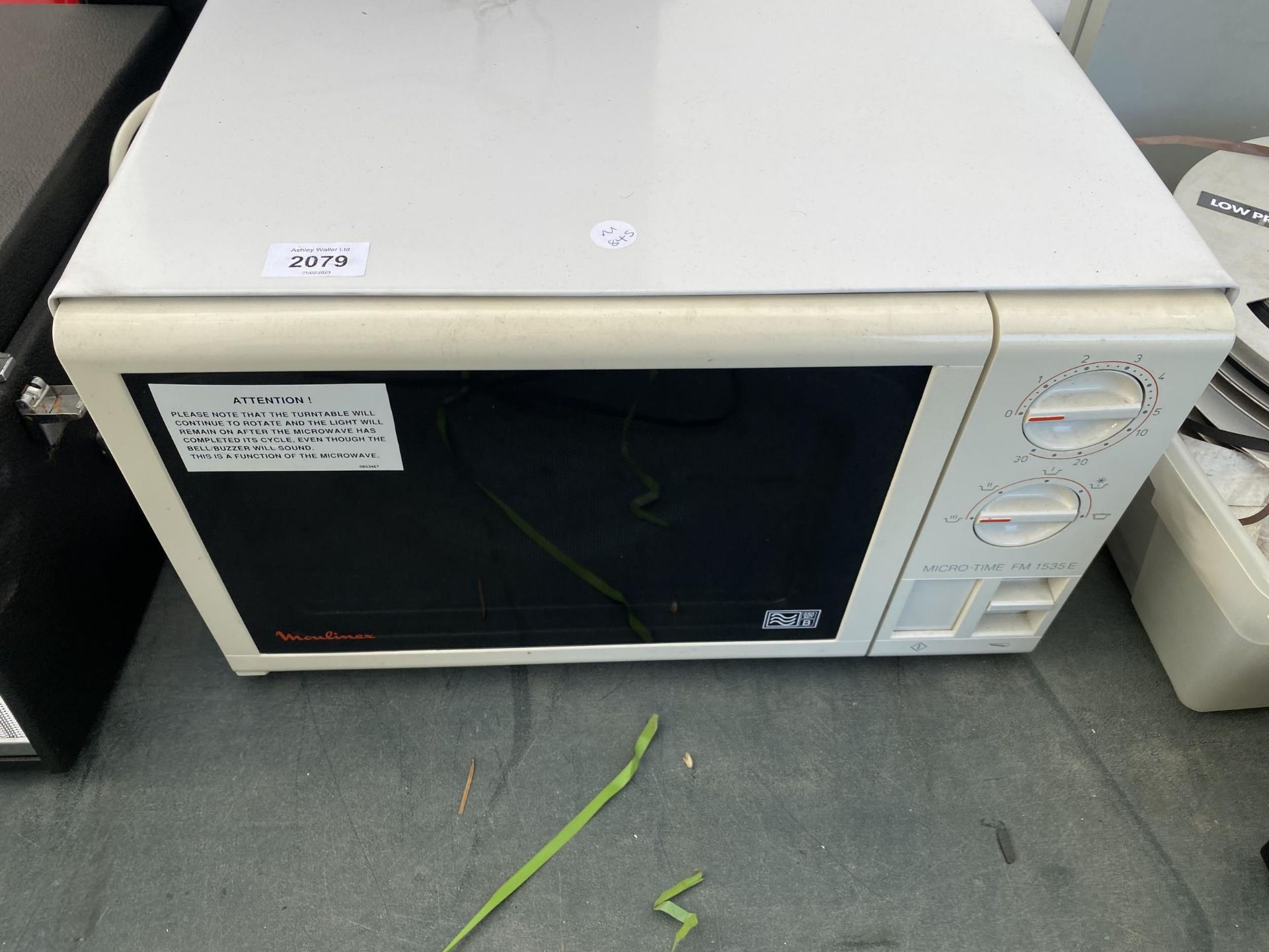 A WHITE MOULINEX MICROWAVE OVEN