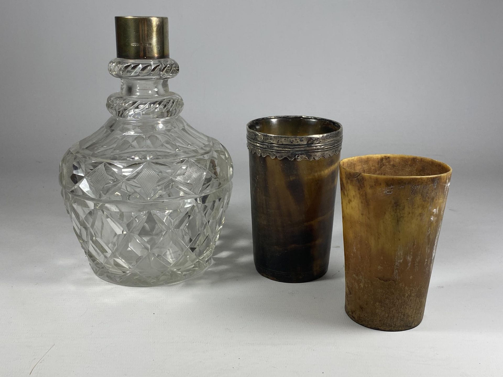 THREE ITEMS TO INCLUDE A HALLMARKED SILVER & CUT GLASS DECANTER (NO STOPPER) AND TWO VINTAGE HORN