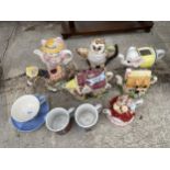 AN ASSORTMENT OF CERAMICS TO INCLUDE TEAPOTS AND MUGS ETC