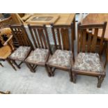 A SET OF FOUR EARLY 20TH CENTURY OAK DINING CHAIRS