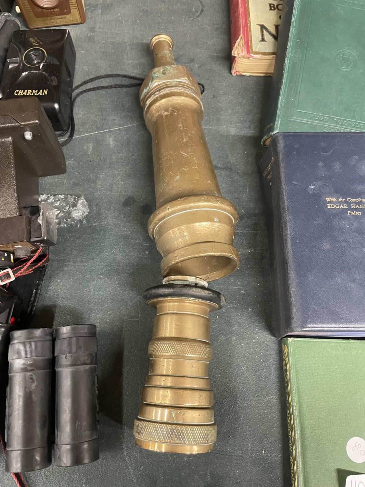 A HEAVY BRASS VINTAGE FIRE HOSE NOZZLE AND FITTING