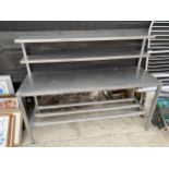 A STAINLESS STEEL KITCHEN UNIT WITH TWO GALLERY SHELVES