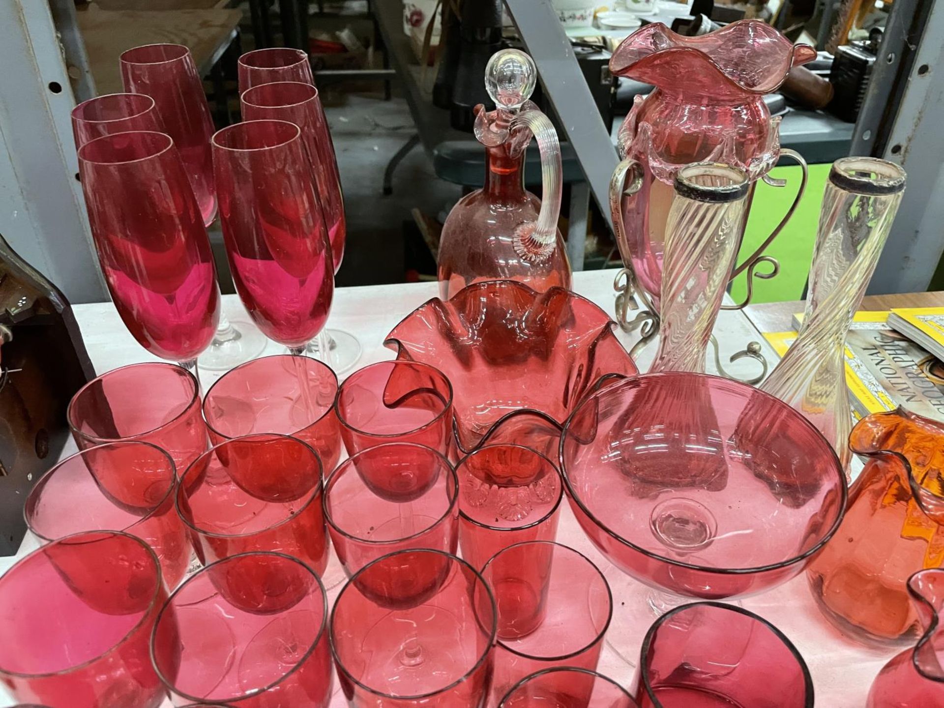 A LARGE QUANTITY OF CRANBERRY GLASS TO INCLUDE DRINKING GLASSES, VASES, JUGS, DECANTER, ETC., - Image 4 of 4