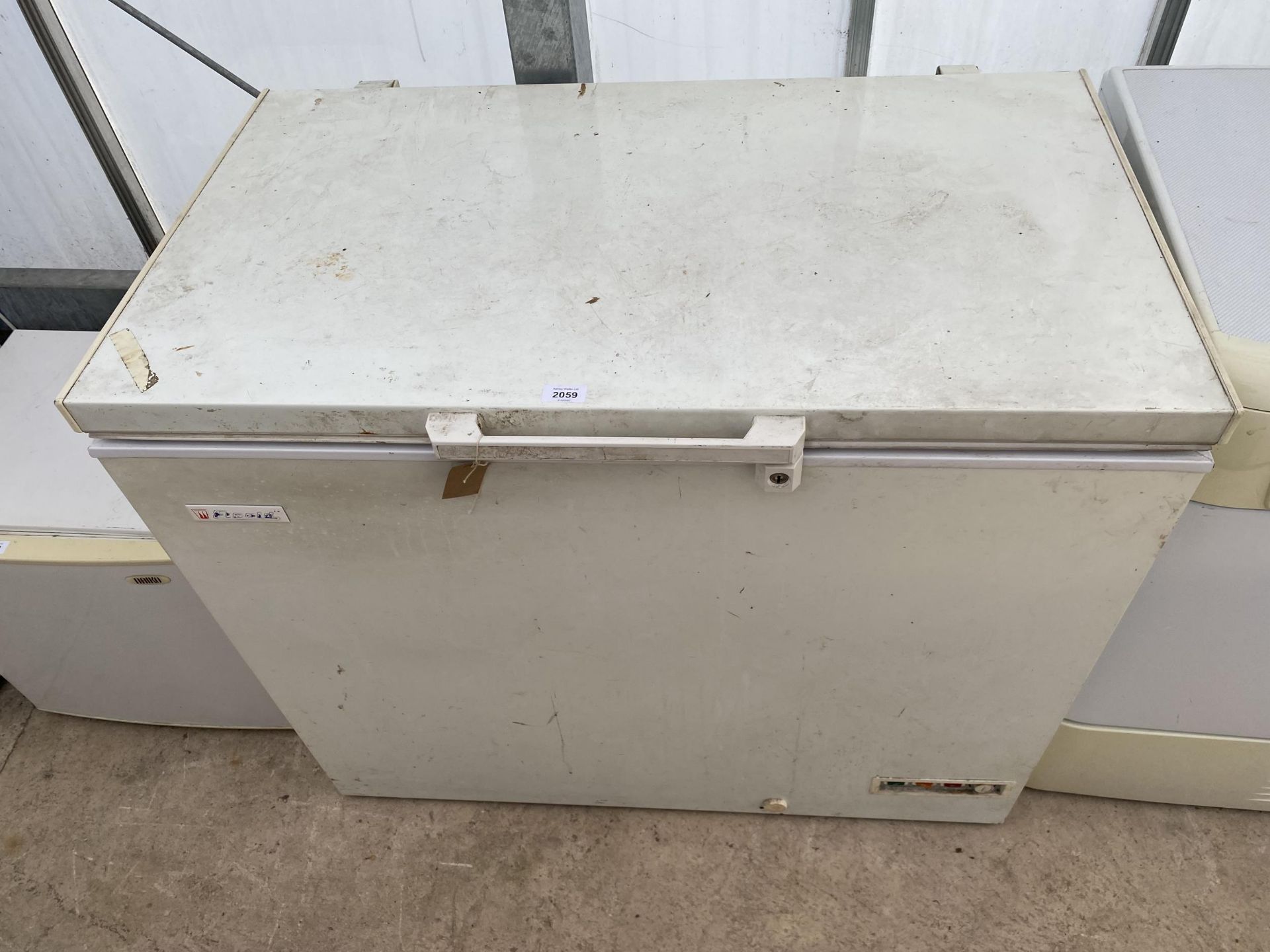 A LARGE WHITE CHEST FREEZER