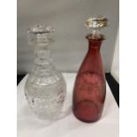 TWO GLASS DECANTERS ONE BEING CRANBERRY WITH GILT DECORATION