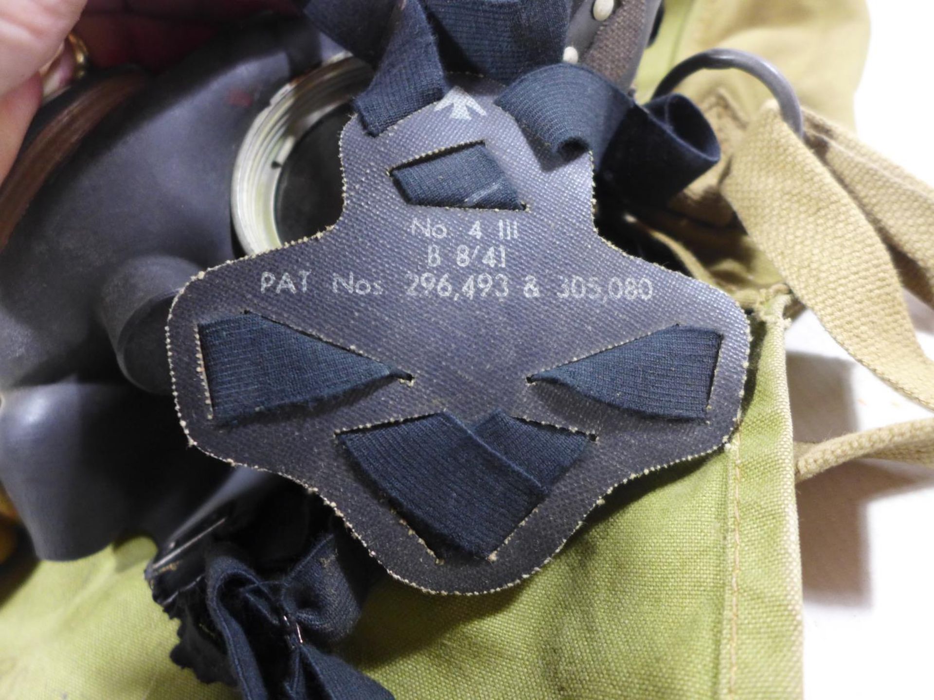 A WORLD WAR II MILITARY ISSUE GAS MASK AND BAG - Image 4 of 4