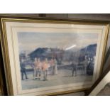 A FRAMED PRINT OF GOLFERS ON A PUTTING GREEN