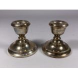 A PAIR OF BIRMINGHAM HALLMARKED SILVER DWARF CANDLESTICKS, HEIGHT 7CM